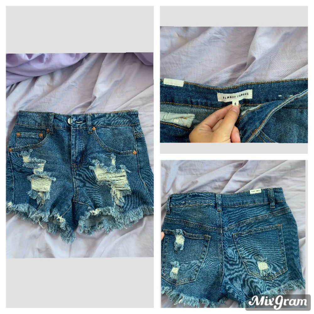 blue ripped jean shorts.